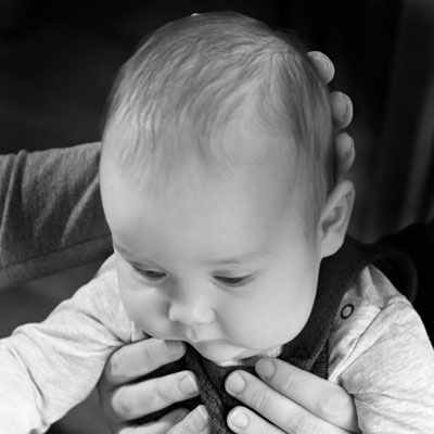 Baby being held in hands - craniosacral